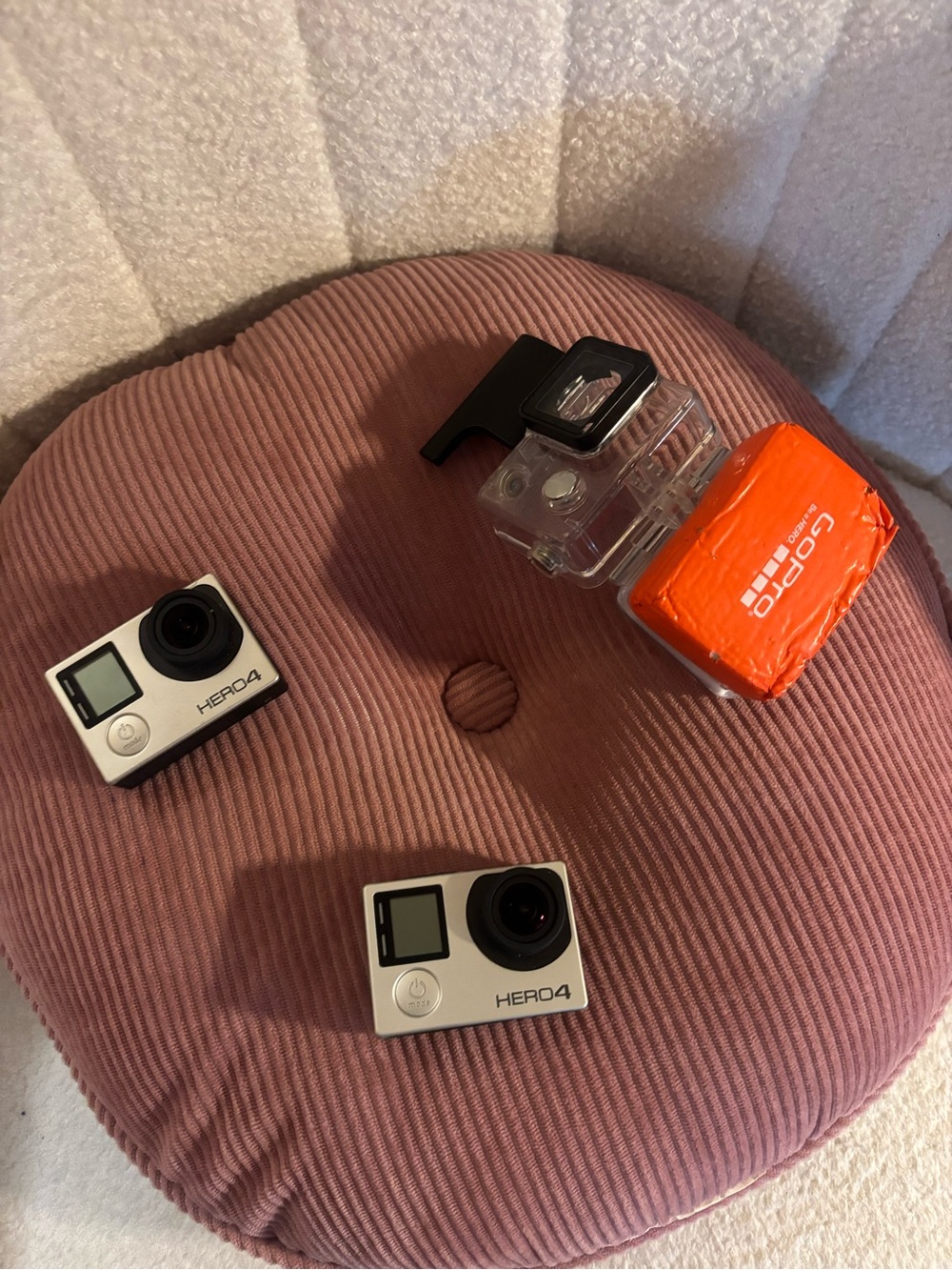 GoPro HERO4 White and Black Cameras with Orange Floaty Housing